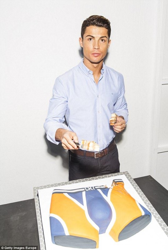 Ronaldo-poses-for-a-photo-with-a-piece-of-the-brief-shaped-cake-on-Sunday