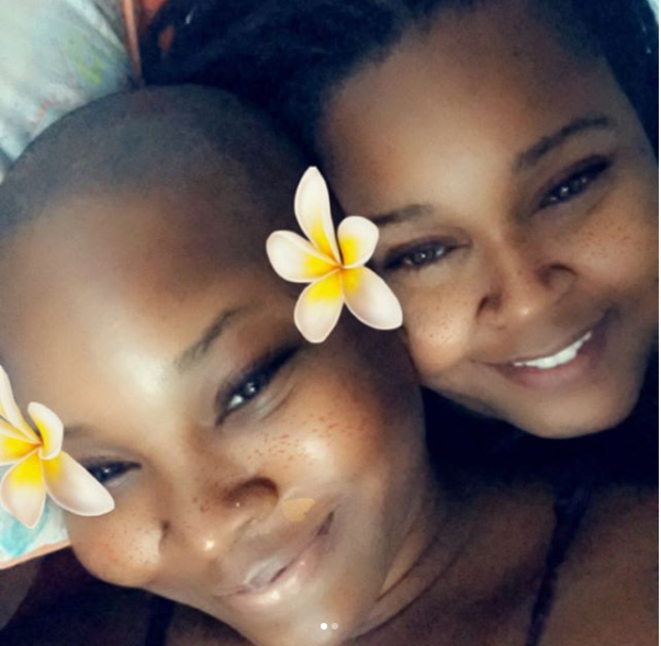 Charly Boy's daughter Dewy and her partner SJ loved-up in bed in new photos