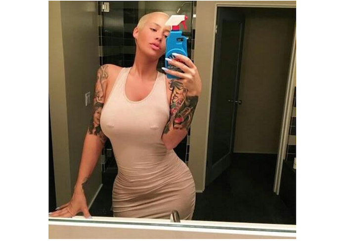 Amber Rose shows off her nipple piercing theinfong.com 700x488