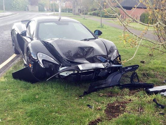 Motorist crashes his £200,000 car minutes after it's delivered to his home theinfong.com