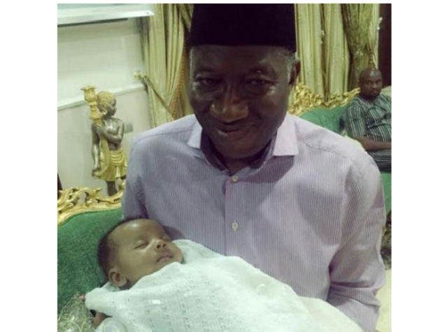 Jonathan cradling Femi Fani-Kayode’s cute son