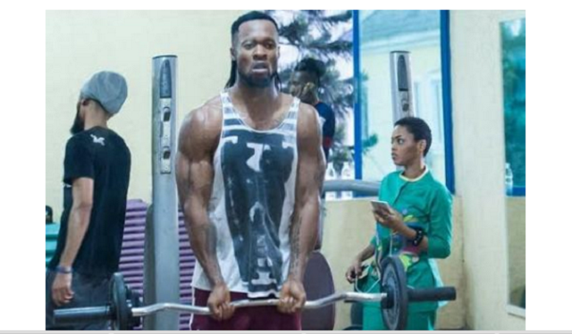 Flavour shows off his muscles
