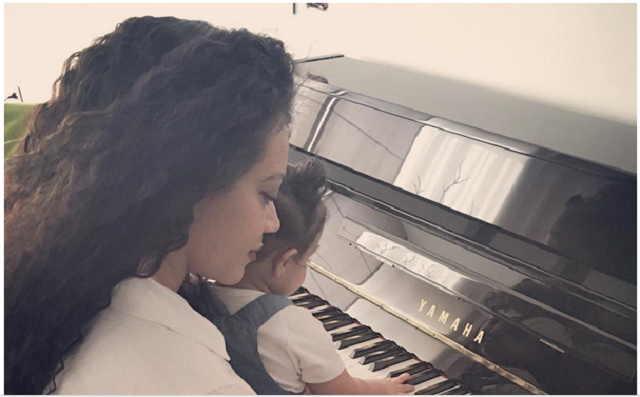 Nadia Buari teaches her one of her twin daughters