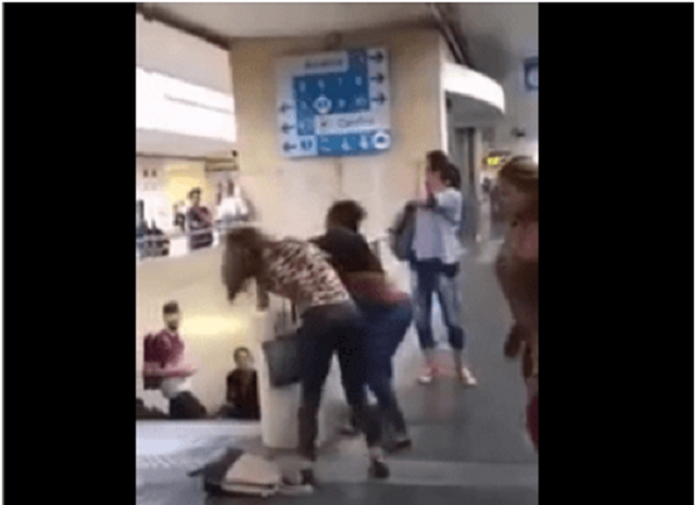 Benin girls fight over a man at train station in Europe