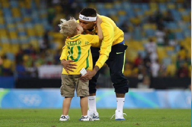 Neymar kissing his son after Olympics Gold win