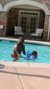 Davido teaches his second daughter, Hailey how to swim 