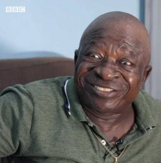 Women rejected me for 20 years due to my looks. The one who accepted me tasted it and confirmed – Veteran actor, Uwaezuoke 

Veteran Nigerian actor, Stephen Alajemba aka Uwaezuoke has shared his his personal experience of facing rejection from women due to his looks during his early adulthood. 

He revealed this in a recent interview with popular YouTuber, Yan Kontent Factory, where he recollected his childhood memories.

Uwaezuoke revealed that women "ran away" upon seeing him due to his "facial look and stature." 

According to him, this rejection lasted "before one accepted me" and he was "already 20 to 22 years old." 

He eventually found someone who accepted him despite the previous rejections.

He said; “Any lady who sees my facial look and stature runs away. Unfortunately before one accepted me I was already 20 to 22 years old. I married at 23. So the first person tasted it and confirmed it and she did not leave me anymore.”

