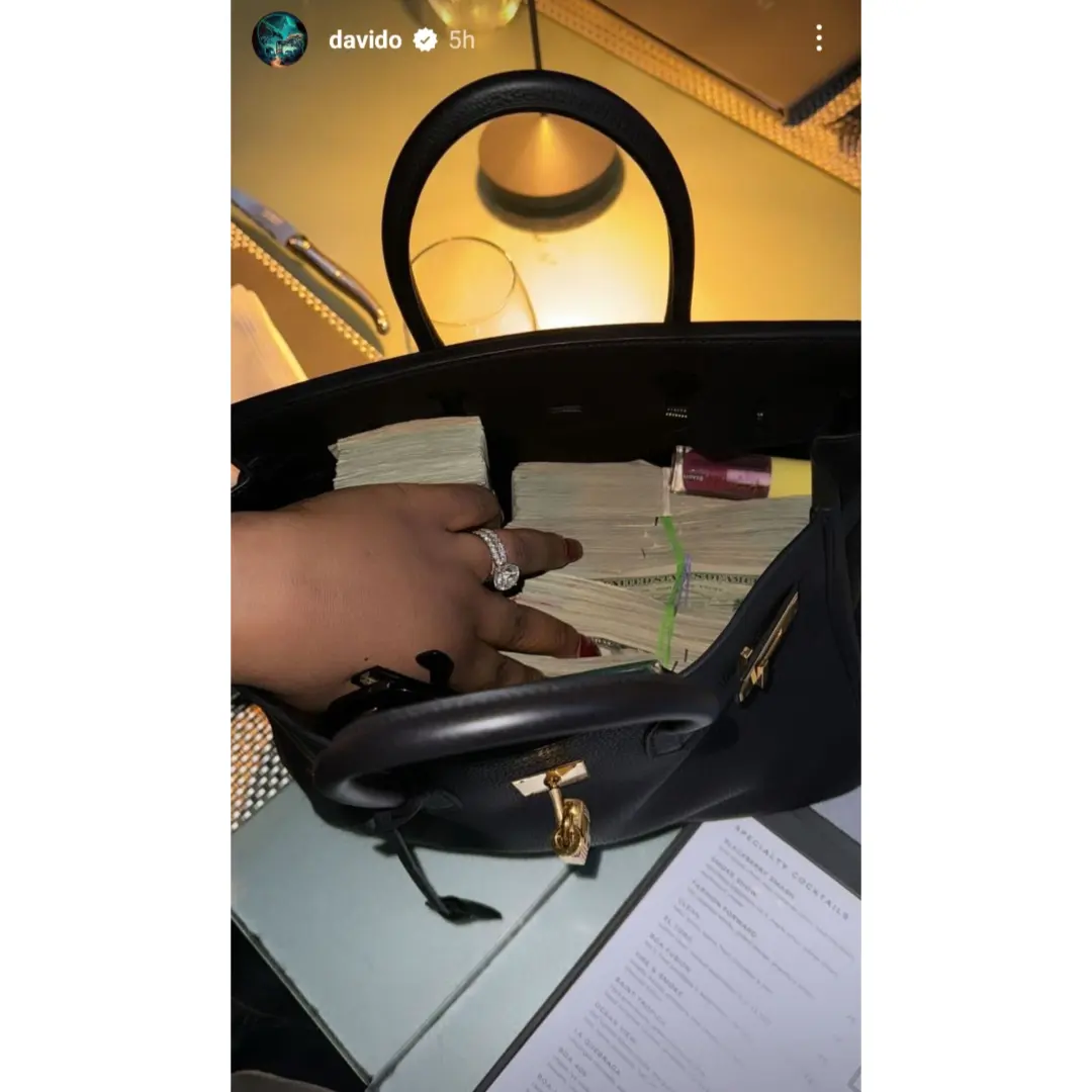 "It’s better to cry in Dubai than cry in Lagos" Reactions as Davido spoils wife, Chioma with wads of cash and roses amid cheating