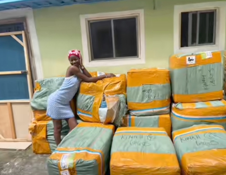 Businesswoman celebrates her business's transformation as it grows from 10 to 100 cartons