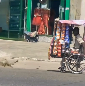 Physically challenged man selling goods from wheelchair stirs emotional reactions