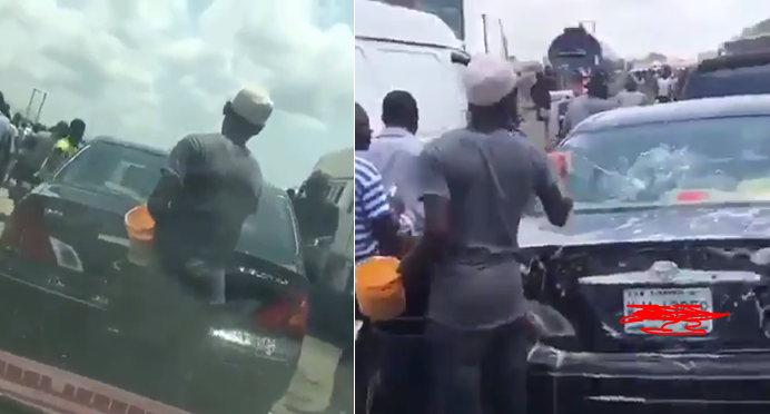 Watch the trending video of a guy who washes cars in Lagos Traffic