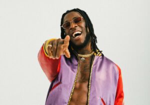 Make sure it goes round for everyone -Burna Boy says as he gifts 'area boys' wads of N1000 note (Video)