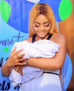 Regina Daniels father finally blesses her marriage, attends his grandson's naming ceremony (Video)